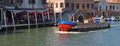 Delivery boat on the busy Cannaregio Canal , Venice Italy.