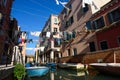 Venice Italy street with laundry washed clothes hanging out to dry on ropes between houses