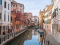 Venice, Italy - 17.10.2023: Tourist sightseeing colorful old buildings of the city walking by many of small channels. Warm sunny Royalty Free Stock Photo