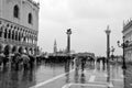 Tourists on a rainy day in Piazza San Marco St Marks Square. Royalty Free Stock Photo