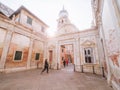 Venice, Italy - 17.10.2023: tourists sightseeing old magnificent buildings. Sun flare, light pastel color of the walls