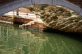 Venice, Italy. Traditional canal bridge reflection on green water. Royalty Free Stock Photo