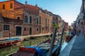 Venice, Italy - 16.08.2019: Traditional gondolas in venetian water canal in Venice. Beautiful turistic place Royalty Free Stock Photo