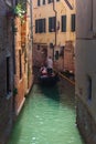 Venice, Italy - 17.08.2019: Traditional gondolas in venetian water canal in Venice. Beautiful turistic place Royalty Free Stock Photo