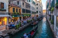 Venice, Italy - 15.08.2019: Traditional gondolas in venetian water canal in Venice. Beautiful turistic place Royalty Free Stock Photo