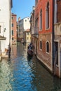 Venice, Italy - 17.08.2019: Traditional gondolas in venetian water canal in Venice. Beautiful turistic place Royalty Free Stock Photo