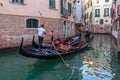 Venice, Italy - 17.08.2019: Traditional gondolas in venetian water canal in Venice. Beautiful turistic place Royalty Free Stock Photo