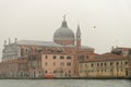 Venice, italy: traditional venice scene. church dome water taxi mist