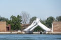 Venice, Italy Venice Biennale, Lorenzo Quinn - Building Bridges hands sculpture