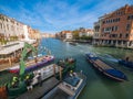 Venice, Italy - 17.10.2023: View on different boats moving in Grand Canal, busy unique city life. Warm sunny day with blue cloudy Royalty Free Stock Photo