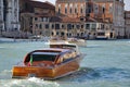 Venice, Italy, Water taxi transporting tourists to Venice