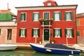 Venice landmark, Burano island canal, colorful houses church and boats, Italy. Royalty Free Stock Photo