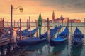 Venice landscape with gondolas at sunset, Italy. Beautiful view on San Giorgio di Maggiore church in Venice