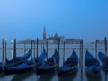 Venice at night with gondolas in the foreground Royalty Free Stock Photo