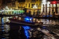 Venice in the night with lights and color with water ambulanza