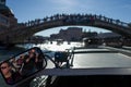 Venice - October 07: Photographer Pierre Aden makes photo of mirror with Ponte dellAccademia and tourists in background