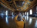 Venice - October 04: Unknown tourist makes a photo in the Palazzo Ducale on October 04, 2017 in Venice