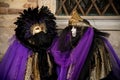 People in costumes and masks on Carnival in Venice