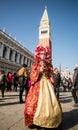 People in costumes and masks on Carnival in Venice