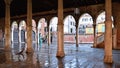 Venice rainy day with colorful corners, old buildings, historical open fish market with wet floor and classic columns , Italy