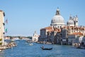 Venice, Saint Mary of Health basilica and Grand Canal with gondola in Italy