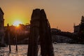Venice - Silhouette of wooden pile and bridge during the sunset over Grand Canal in Venice Royalty Free Stock Photo
