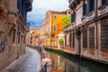 Venice street along canal, Italy. Venezia cityscape. Beautiful Venice