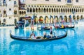 Venice Theme Venetian with Gondola on water with tourists in Las Vegas Royalty Free Stock Photo