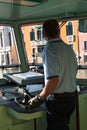 Venice Urban Steamboat Driver in Cabin, Italy