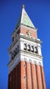 Venice, VE, Italy - February 13, 2024: Bell tower of Venice and blue sky in background