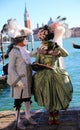 Venice, VE, Italy - February 13, 2024: couple of masked lovers during the Venetian carnival