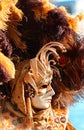 Venice, VE, Italy - February 13, 2024: Mask at the Venetian Carnival with feathered headdress Royalty Free Stock Photo