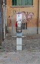 Venice, VE, Italy - February 5, 2018: old telephone box working with tokens or with prepaid cards used in Italy