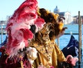 Venice, VE, Italy - February 13, 2024: Venetian Mask at the Venice Carnival and sea of lagoon Royalty Free Stock Photo