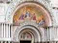 Venice, VE, Italy - May 18, 2020: religious golden mosaic above the door of the Basilica of Saint Mark Royalty Free Stock Photo