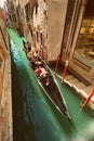 VENICE, VENETO, ITALY - Tourists, gondola riding, typical canal in Venice, September 21, 2017 Royalty Free Stock Photo