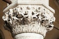 Venice, white capital sculpture with cherubs of Doge palace in Italy Royalty Free Stock Photo