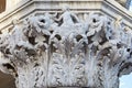 Venice, white capital sculpture with woman, boat and crab, Italy