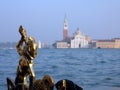 Venician statue on gondola Royalty Free Stock Photo