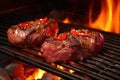 venison steaks on a bbq grill with red flame underneath