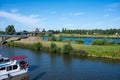 Venlo, Limburg, The Netherlands - Green banks of the River Maas with a pleasure boat