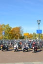 Venlo, Limburg, Netherlands - October 13, 2018: Rows of parked bicycles and motorcycles in the Dutch city close to the main train