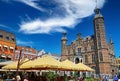 Beautiful dutch square, exterior cafes and restaurants, medieval old town hall, blue summer sky