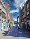 Dutch modern pedestrian zone shopping street, blue summer sky