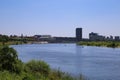 View from cycling track over river maas on skyline of dutch city Venlo in summer