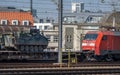 Cargo train owned by german national railway company Deutsche Bahn transporting military vehicles