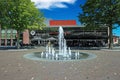 Square in dutch town with water fountain and modern municipal theater building Royalty Free Stock Photo