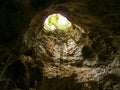 The vent inside the cave looked through until he could see the sky outside Royalty Free Stock Photo