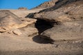 Ventifact rock formations caused by wind at La Pared Beach, Fuerteventura Royalty Free Stock Photo
