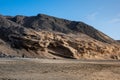 Ventifact rock formations caused by wind at La Pared Beach, Fuerteventura Royalty Free Stock Photo
